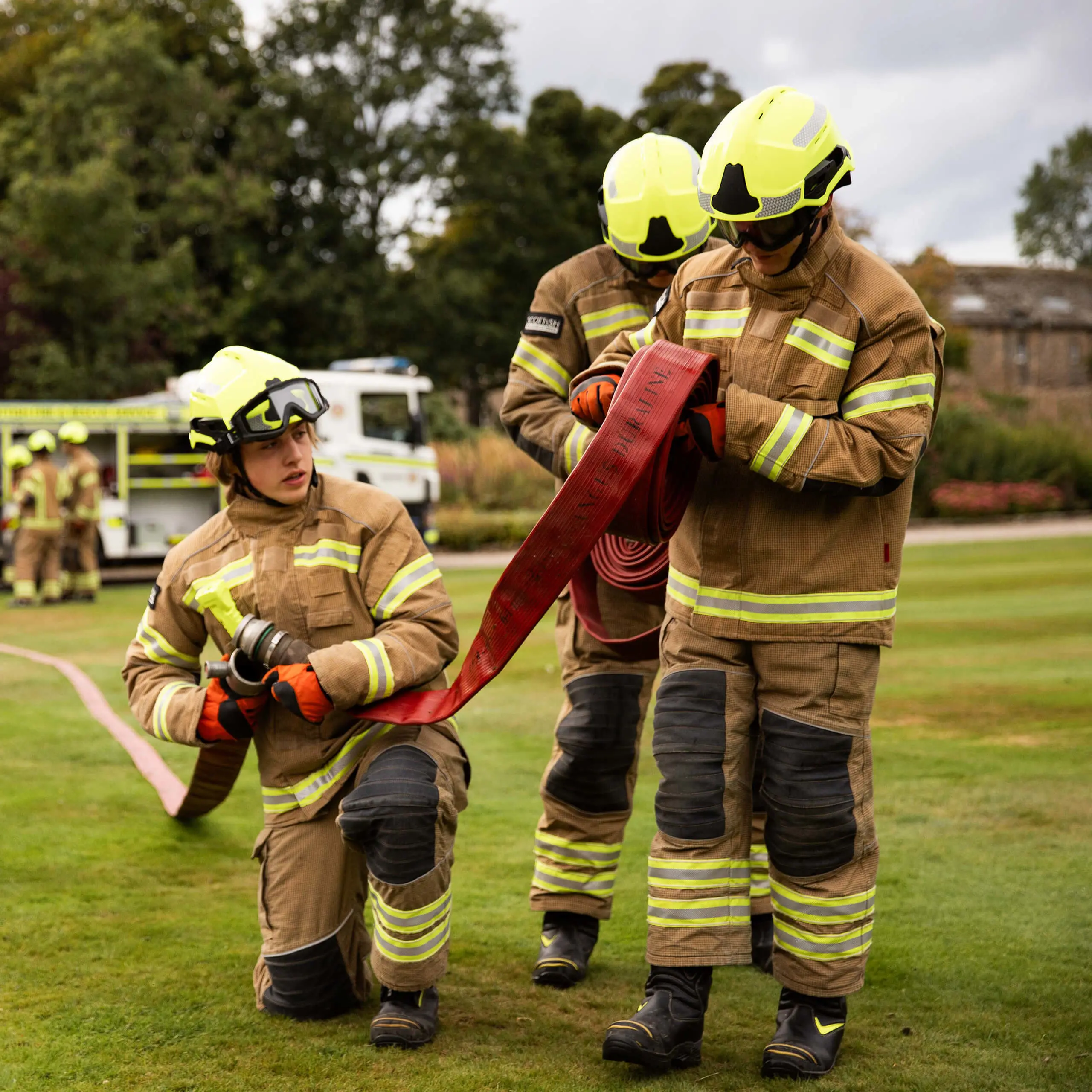 Gordonstoun Fire Service rolling out fire hoses on the South lawn in front of Gordonstoun House