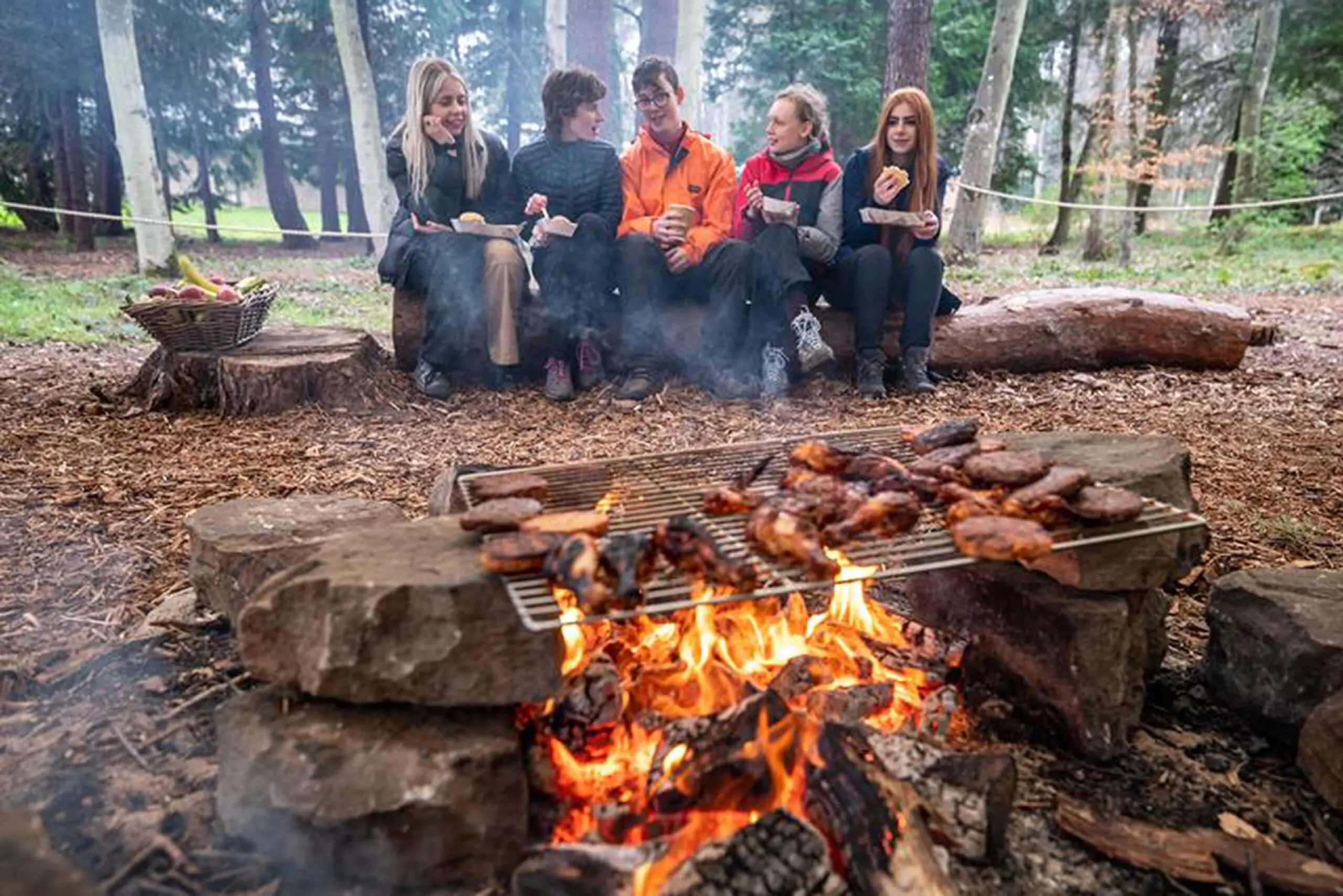 Students enjoy a blazing campfire