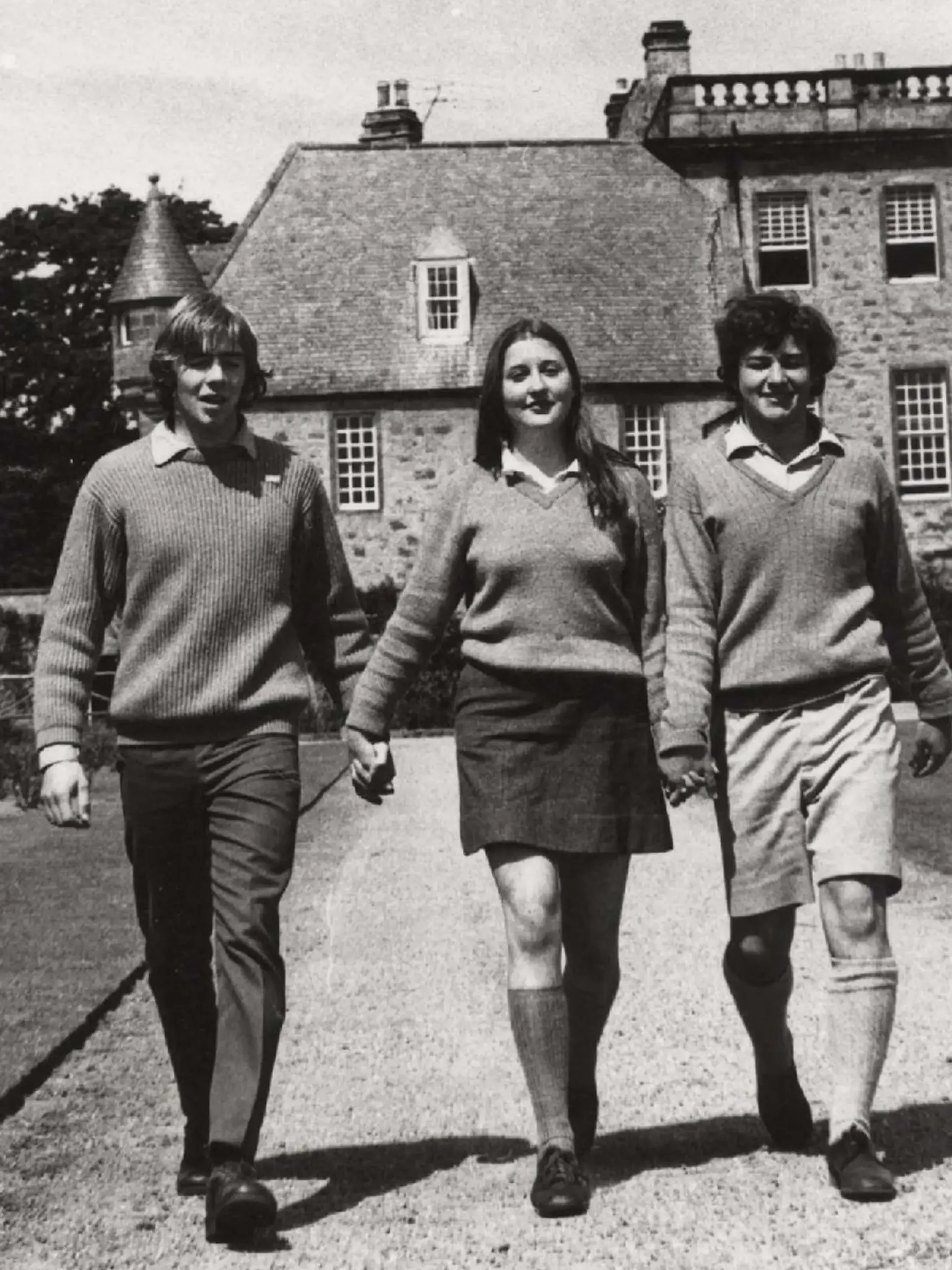 The first girls at Gordonstoun walk down the South lawn with boys showing the moment Gordonstoun became coeducational in 1972.