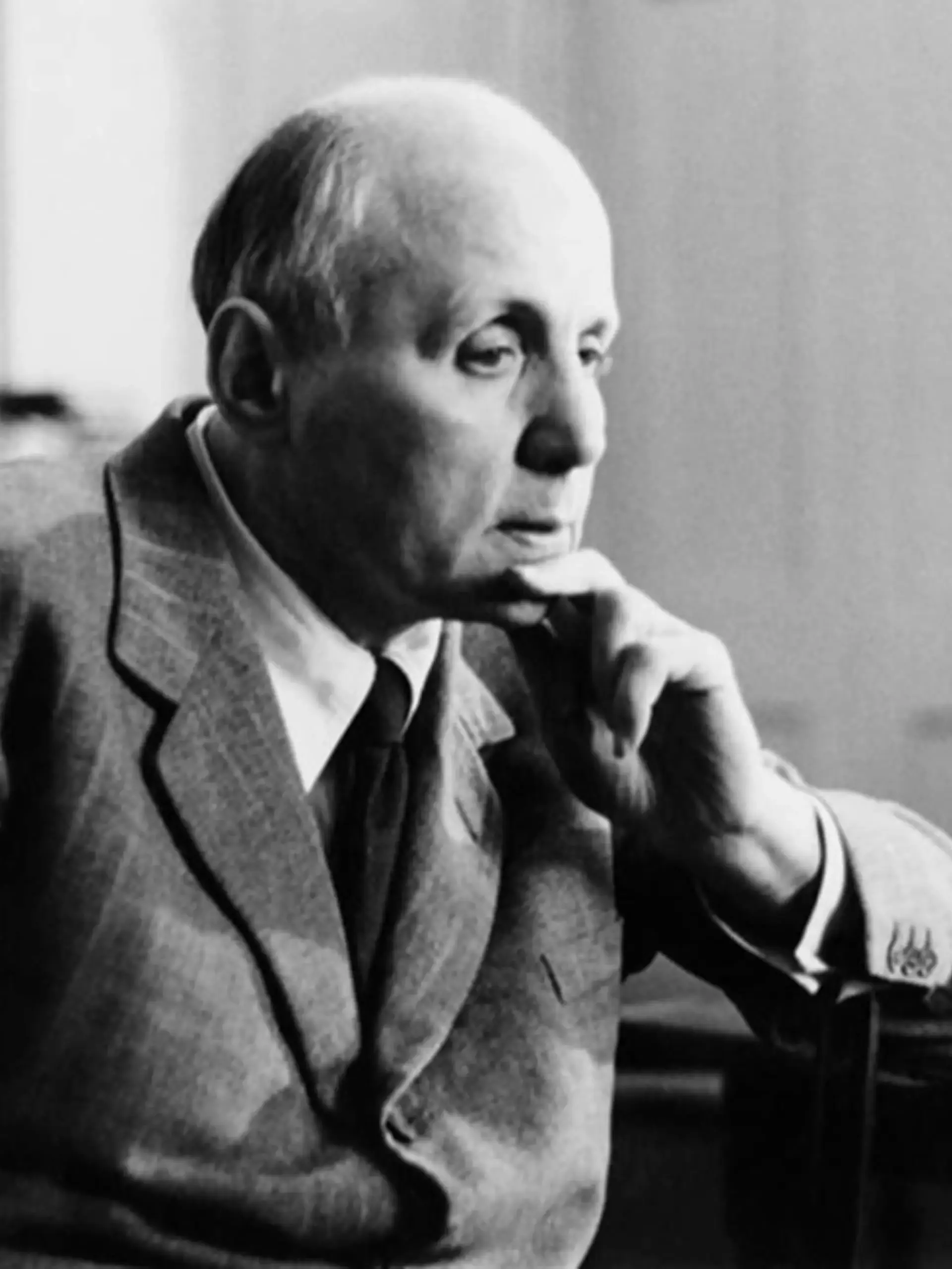 Kurt Hahn, Founder of Gordonstoun looking thoughtful at a desk. Black and white image.