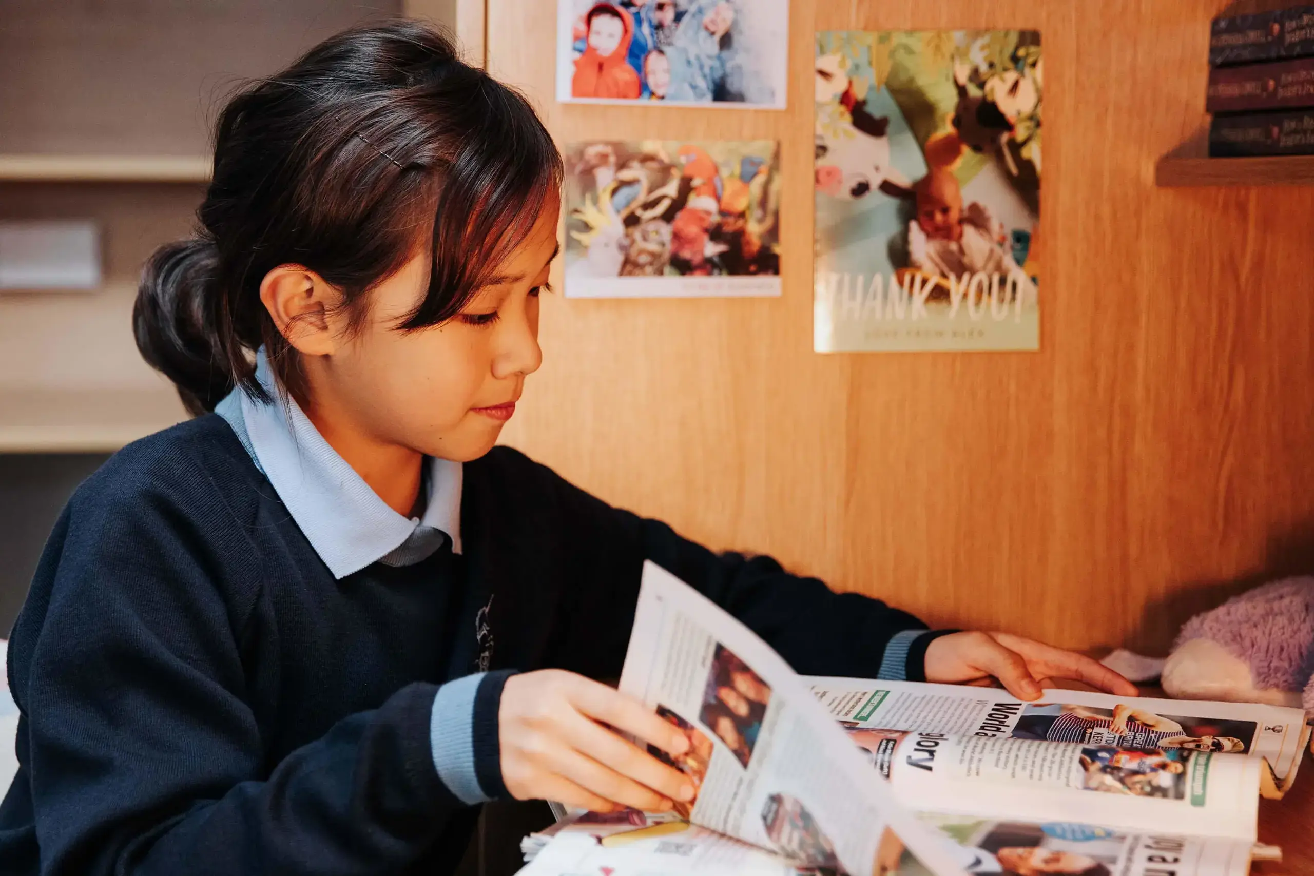 Gordonstoun Prep pupil reading at their desk in their dormitory