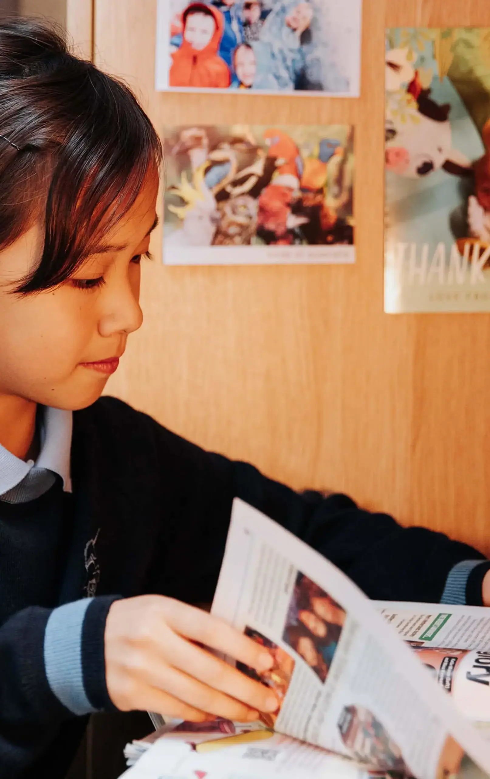 Gordonstoun Prep pupil reading at their desk in their dormitory