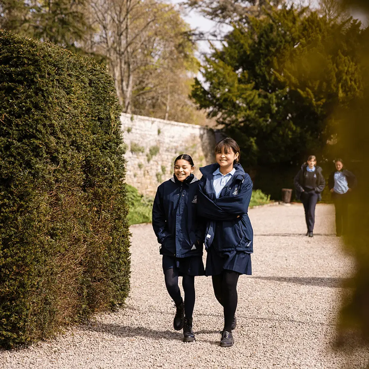 Teenage Students Walking The School Grounds