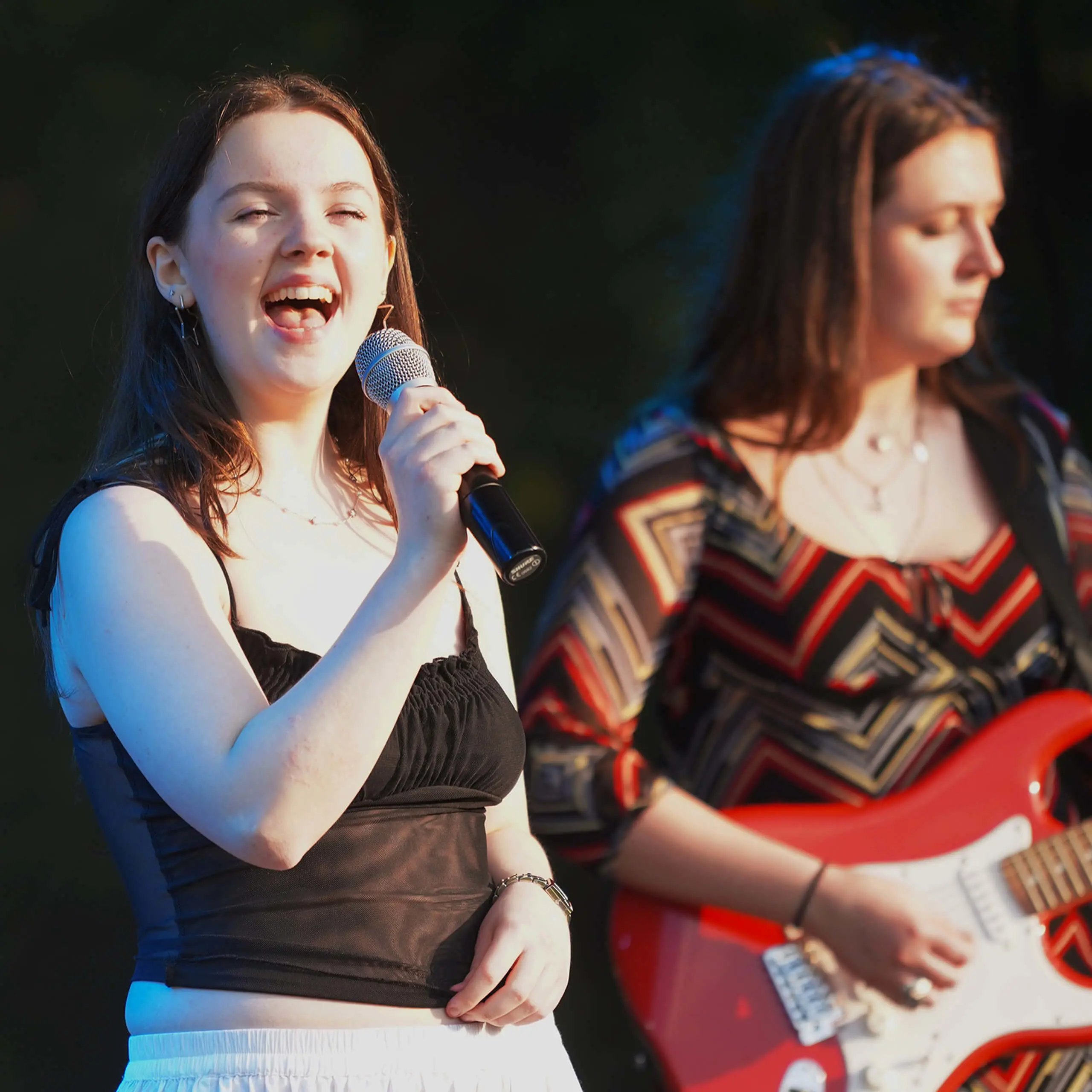 Senior pupil singing with microphone