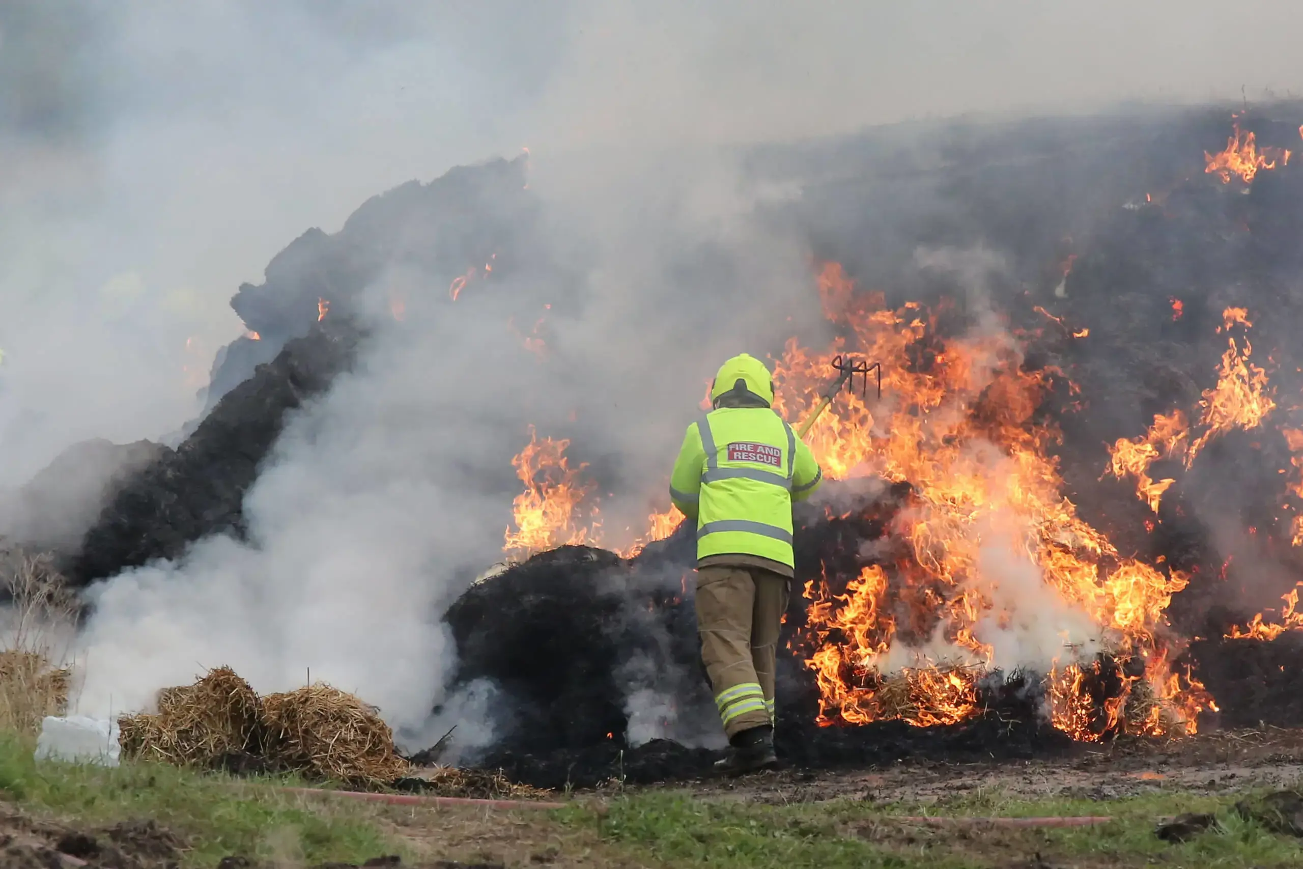 Student fighting a farm fire