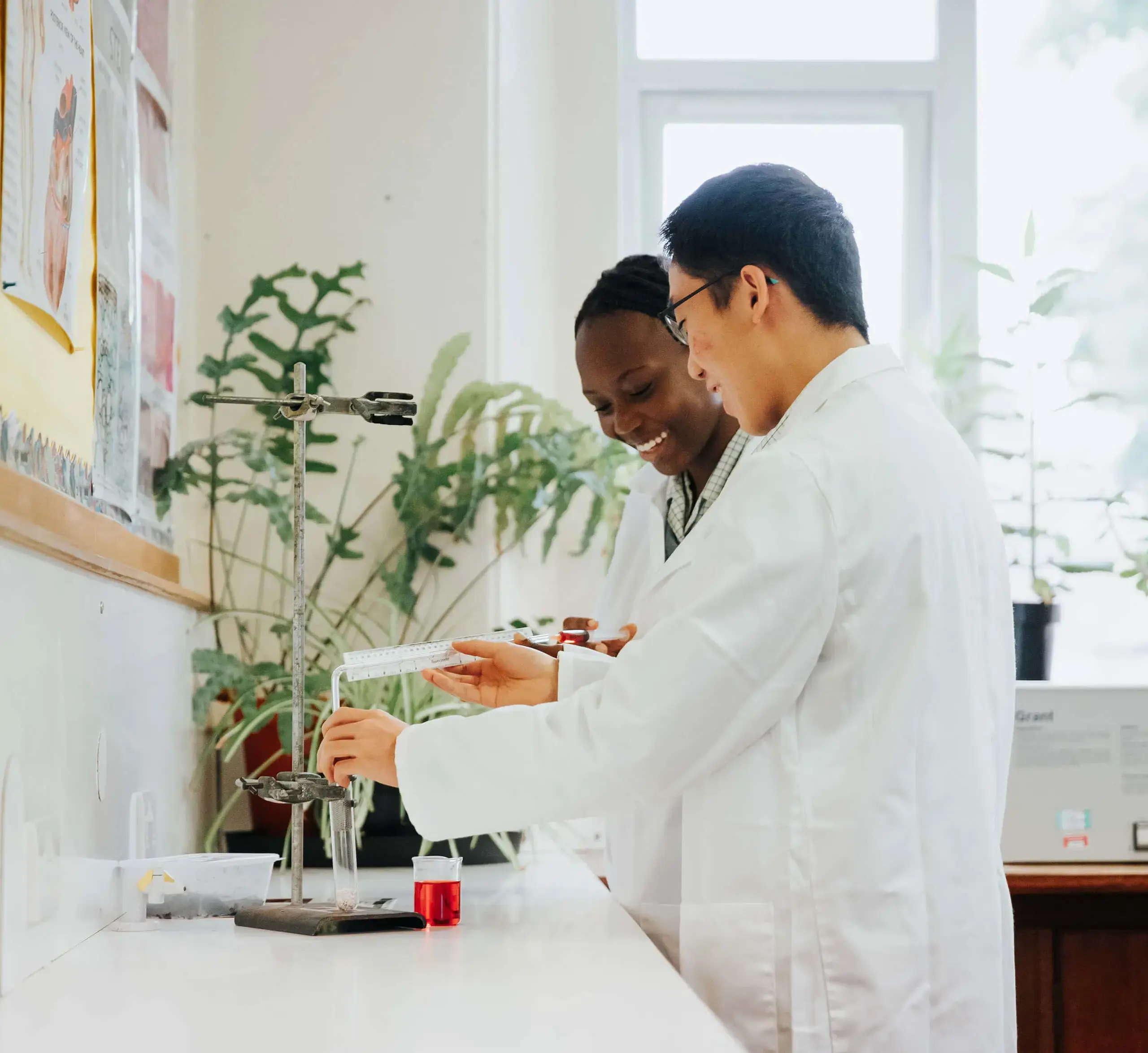 Two Gordonstoun students conducting a biology experiment.