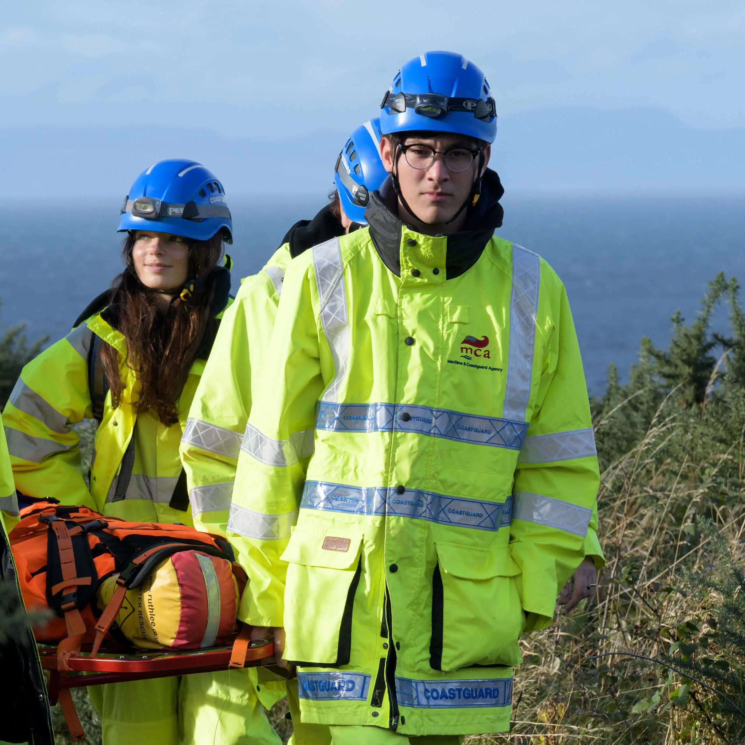 Student members of Gordonstoun's Coastguard Rescue Service training, carrying a dummy on a stretcher.