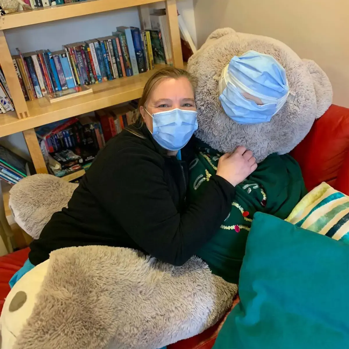 Rachel Waring Wearing a Matching Face Mask With a Large Teddy Bear