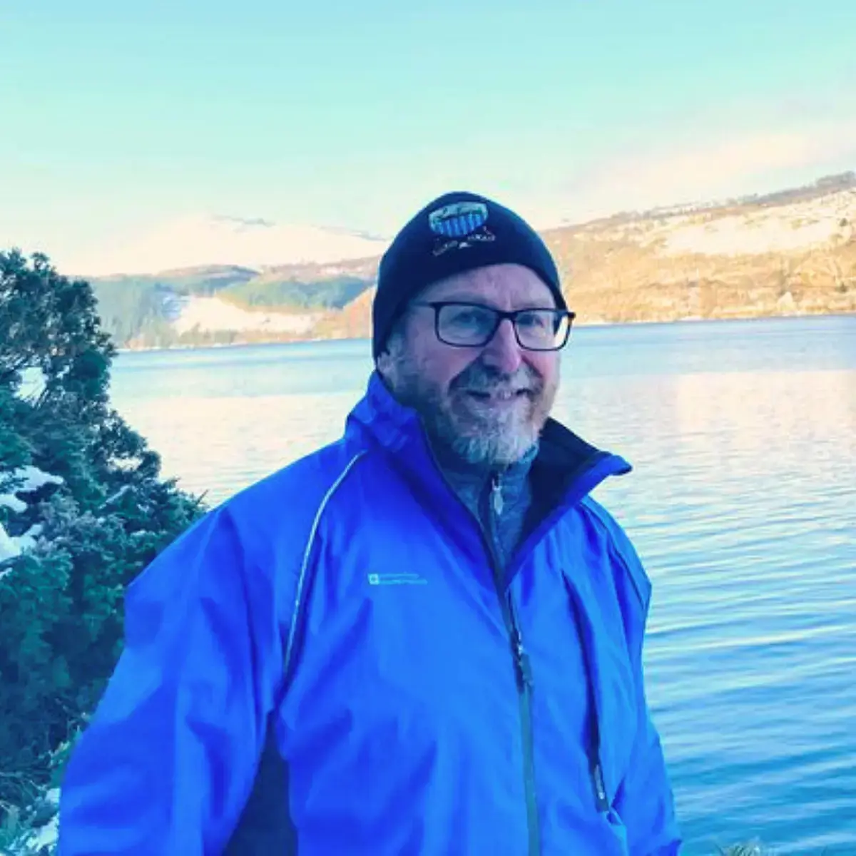 Richard Cavaye in Front of a Large Lake