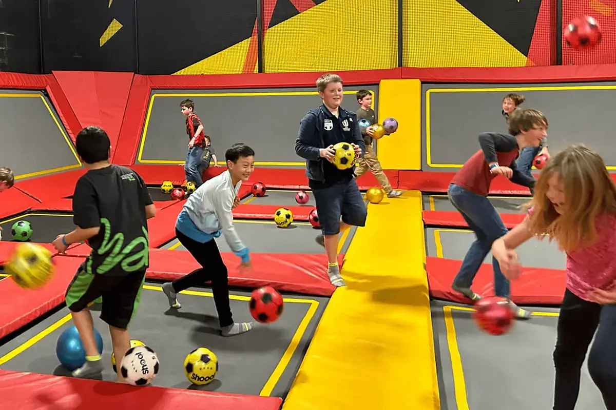 Students Playing on Trampoline Park