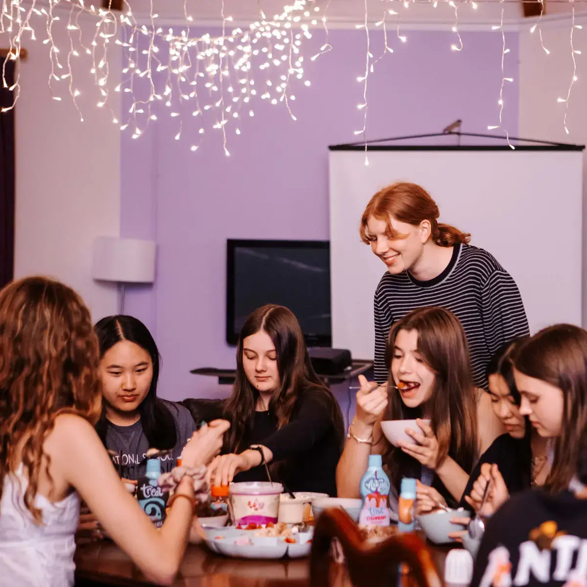 Boarding Students Sharing a Meal Together