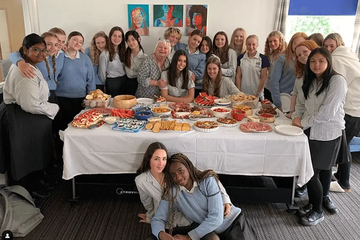 Boarding School Students Sharing a Meal Together