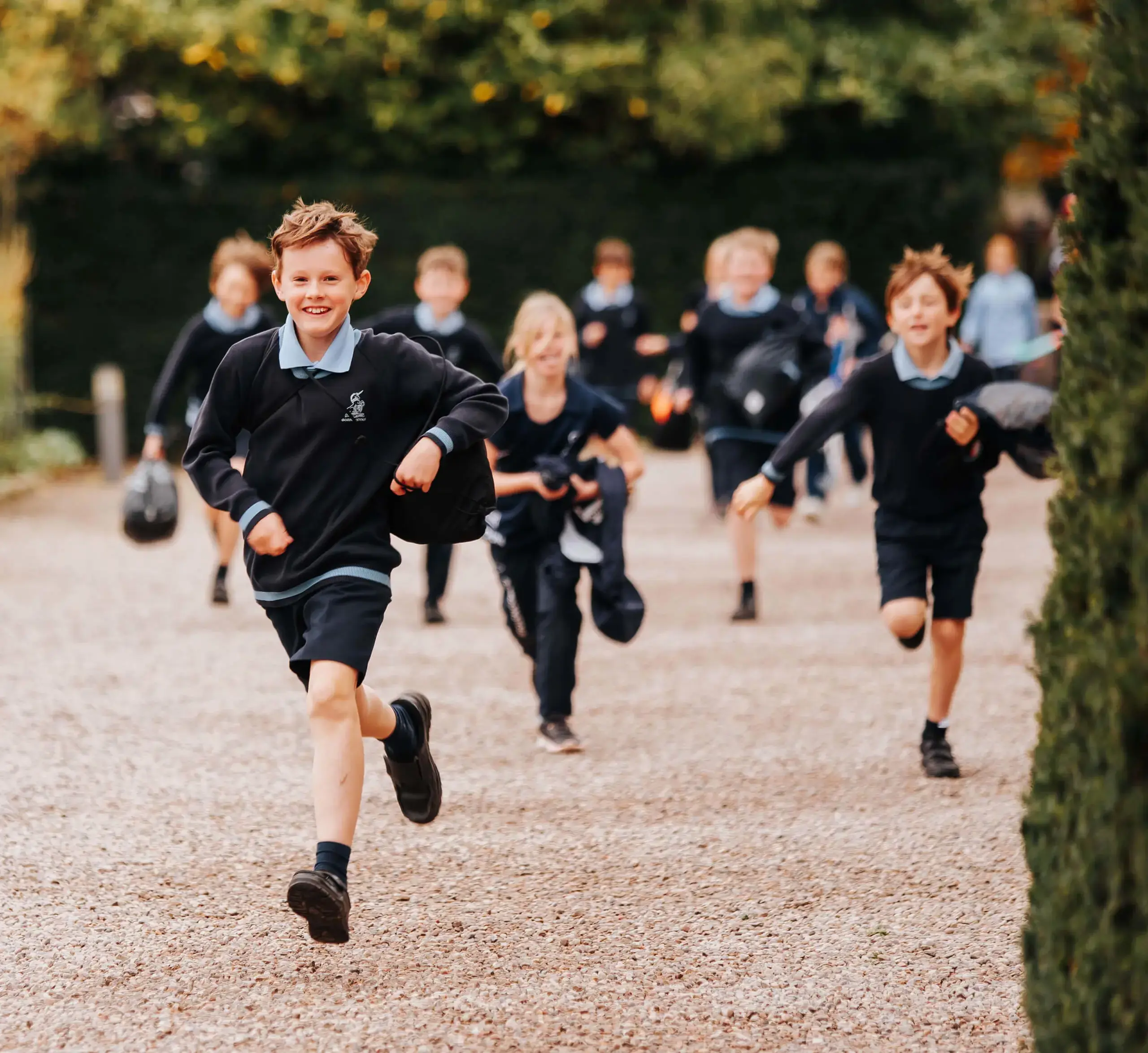 Happy Prep School pupils racing to lunch