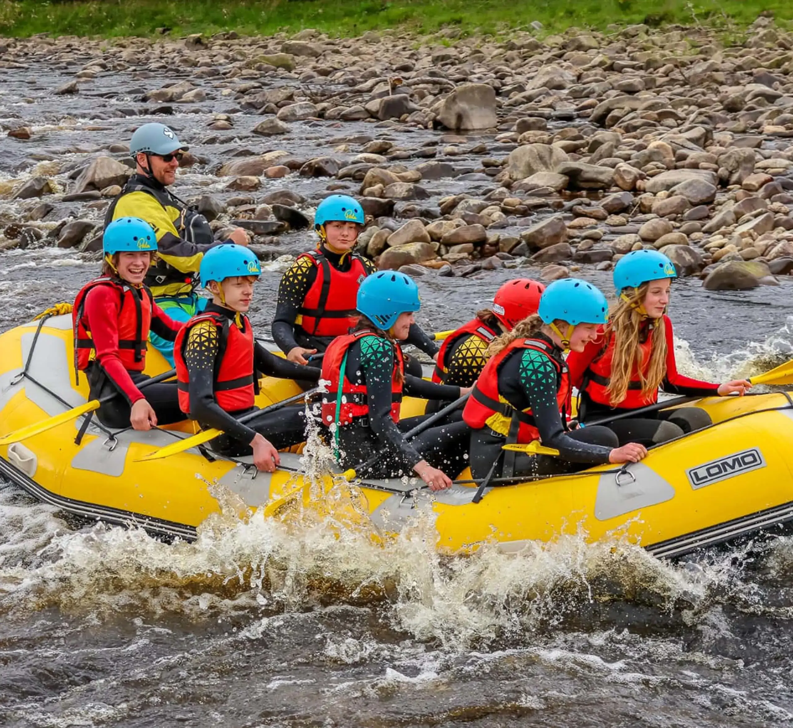 Gordonstoun students laughing during white water rafting on the river Spey