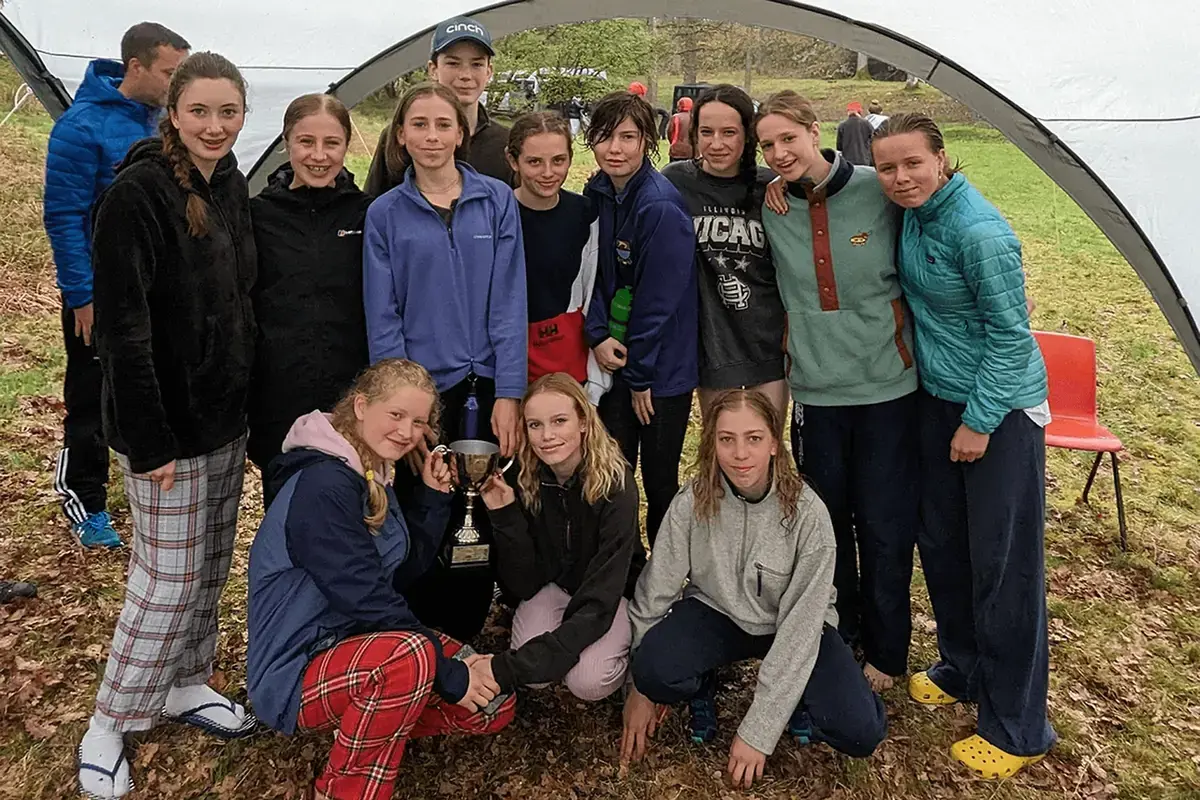 Winning Students of The Adventure Race Posing With Their Trophy