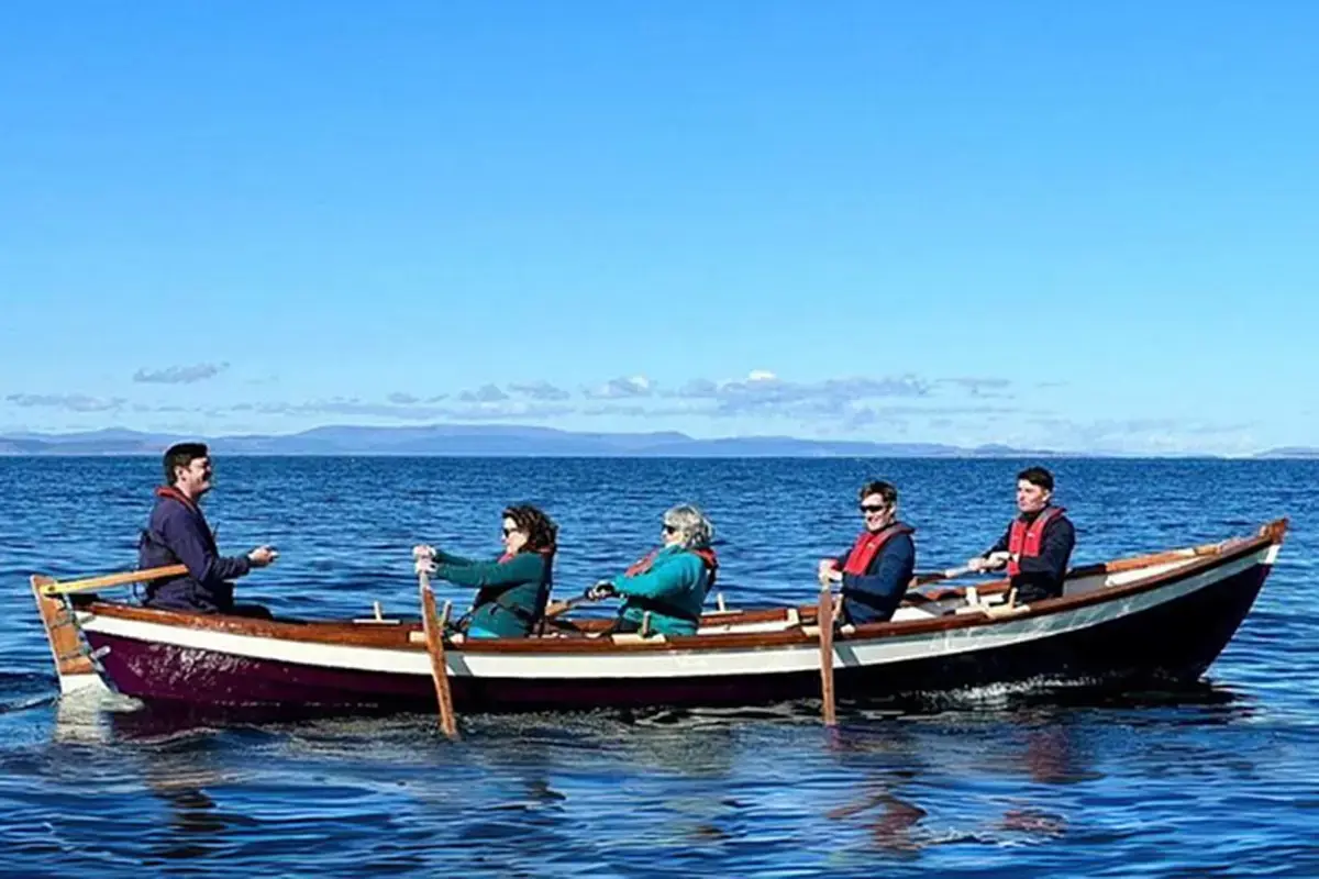 Dan Mclean and Colleagues in Boat